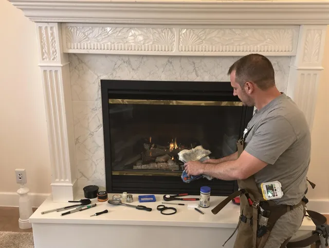 Maynard Chimney Sweep performing fireplace maintenance in Maynard, MA